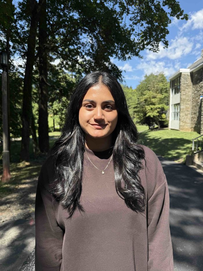 Photo of Peer Adviser, Himani图 on the path to the Lares Building